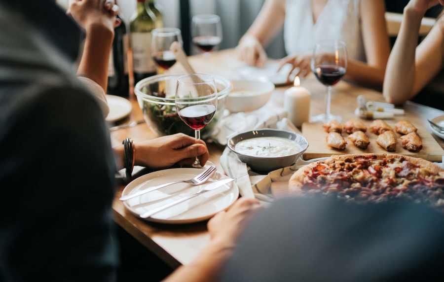 Friends celebrating the moment with drinks near UCE Apartment Homes in Fullerton, California, 