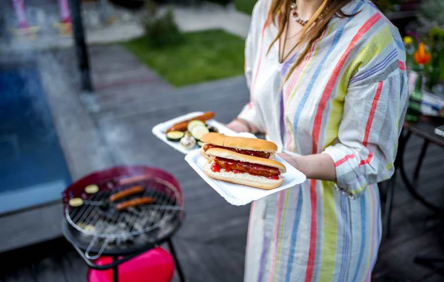 Resident with hot dogs and grilled vegetables at Charleston Square Apartments in Columbus, Indiana