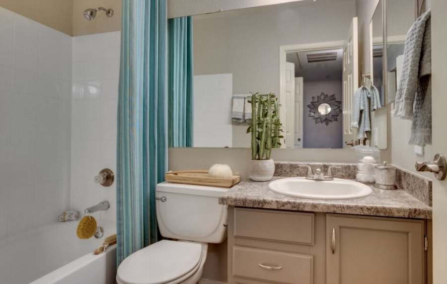 Modern bathroom with large mirror at Alcove at the Islands in Gilbert, Arizona