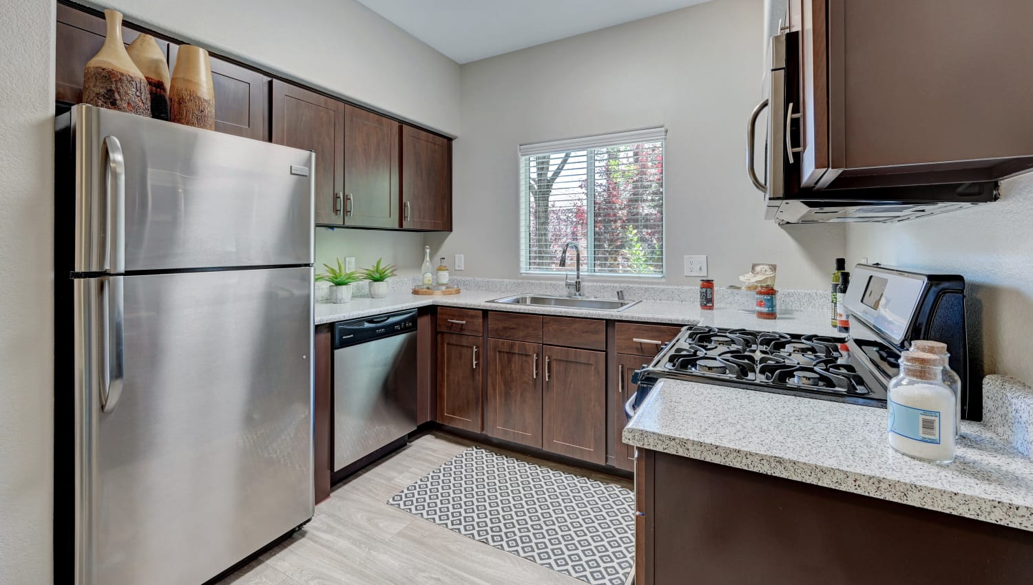 Model kitchen with stainless-steel appliances at Horizon Ridge Apartments in Henderson, Nevada