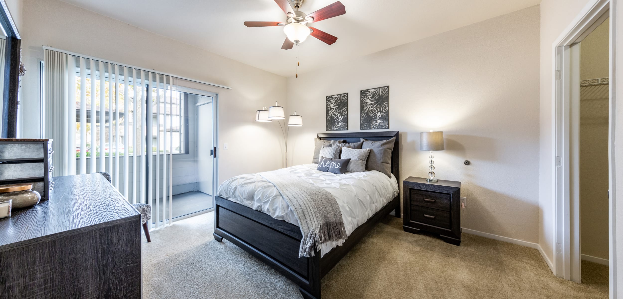 Bedroom with a private patio at The Fairmont at Willow Creek in Folsom, California