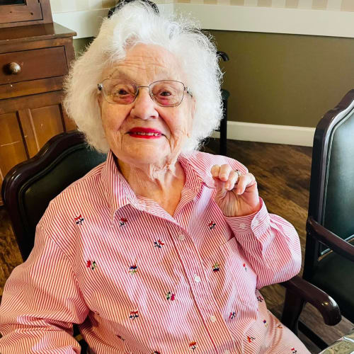 Resident relaxing on her couch at Riverside Oxford Memory Care in Ft. Worth, Texas