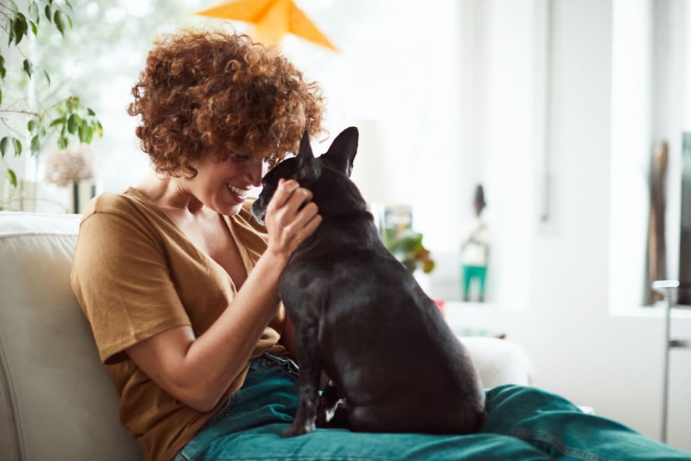 Resident petting her dog at Integra Crossings in Sanford, Florida