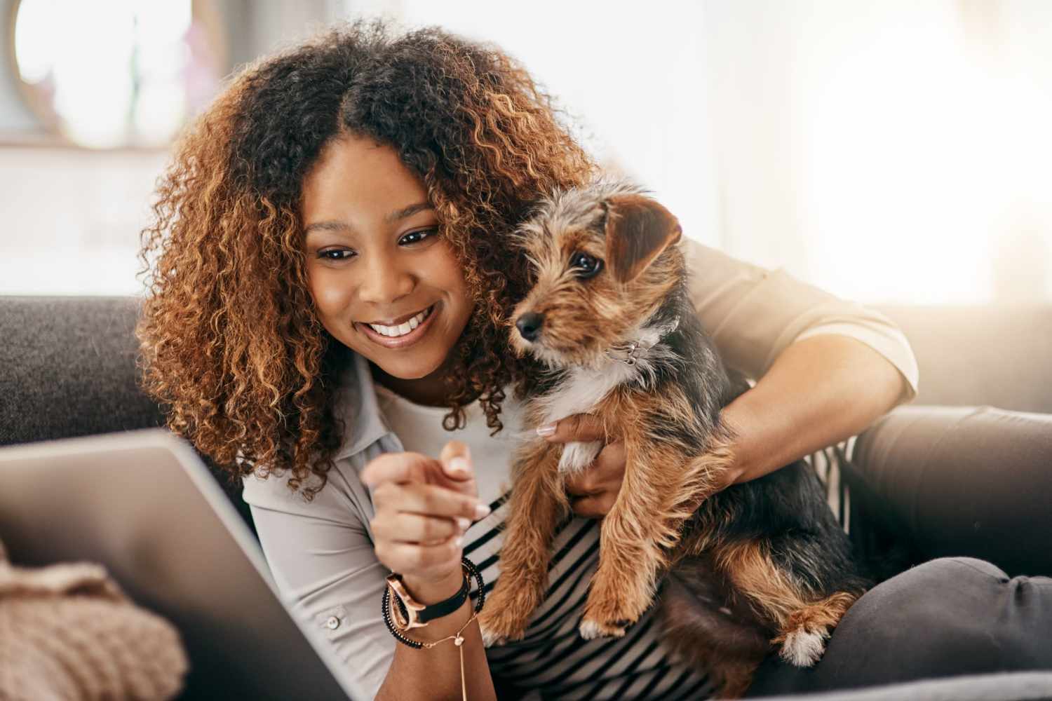 Resident holding her pup in their home at Park Circle Village in North Charleston, South Carolina