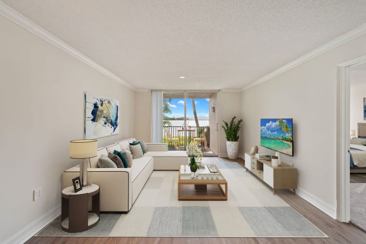 Living room with private balcony at St. Tropez Apartments in Miami Lakes, Florida