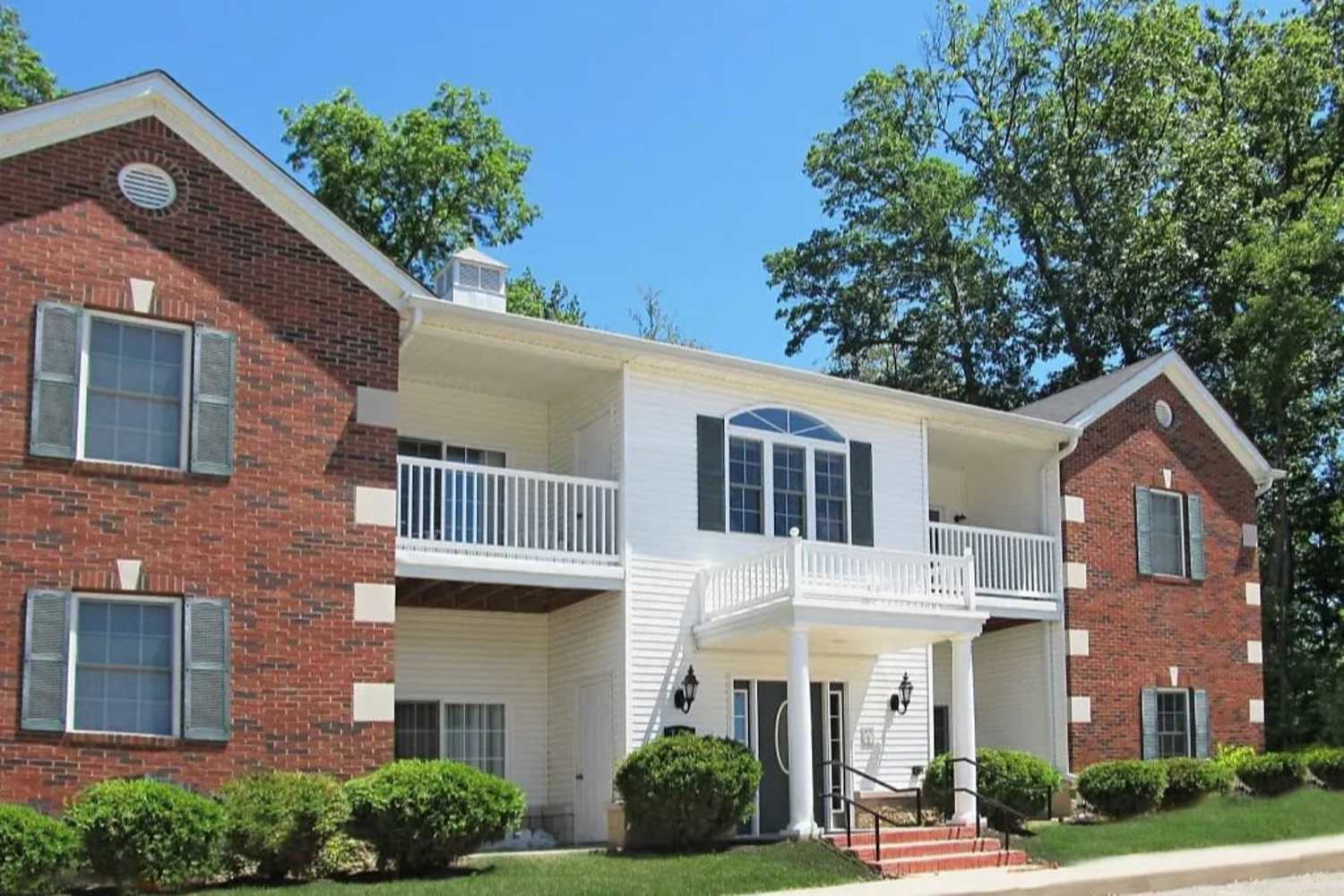 Beautiful view of community with green grass and trees right outside at Forest Ridge in Bloomington, Indiana