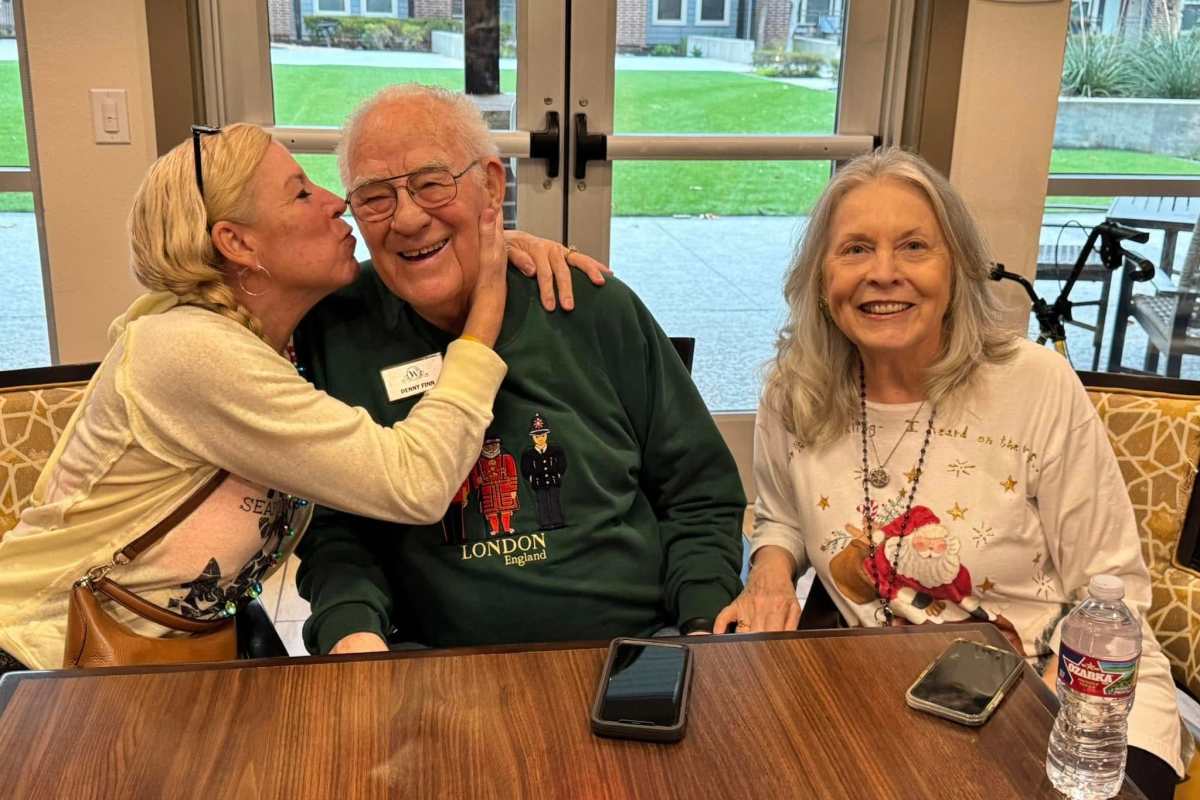 Resident with her grandchildren at Watermere at Woodland Lakes in Conroe, Texas
