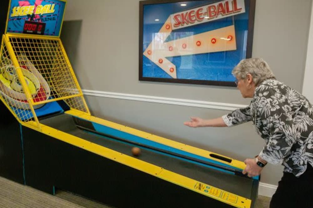 A resident playing skee-ball at Crescent Fields at Huntingdon Valley in Huntingdon Valley, Pennsylvania
