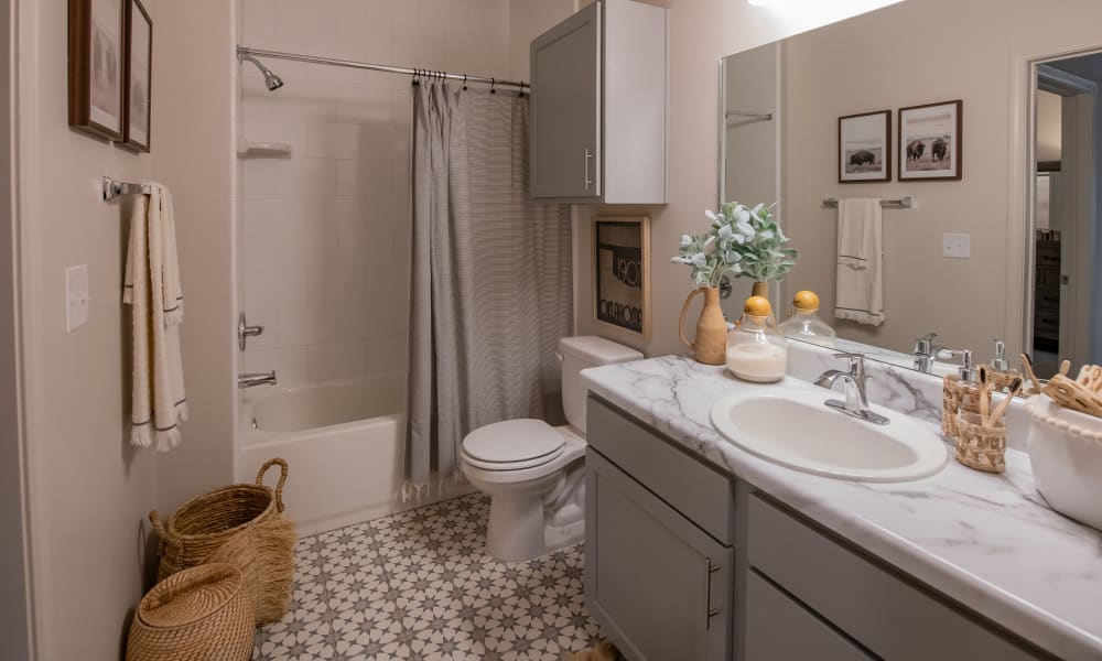 Beautiful bathroom with vast counterspace at Redbud Ranch Apartments in Broken Arrow, Oklahoma