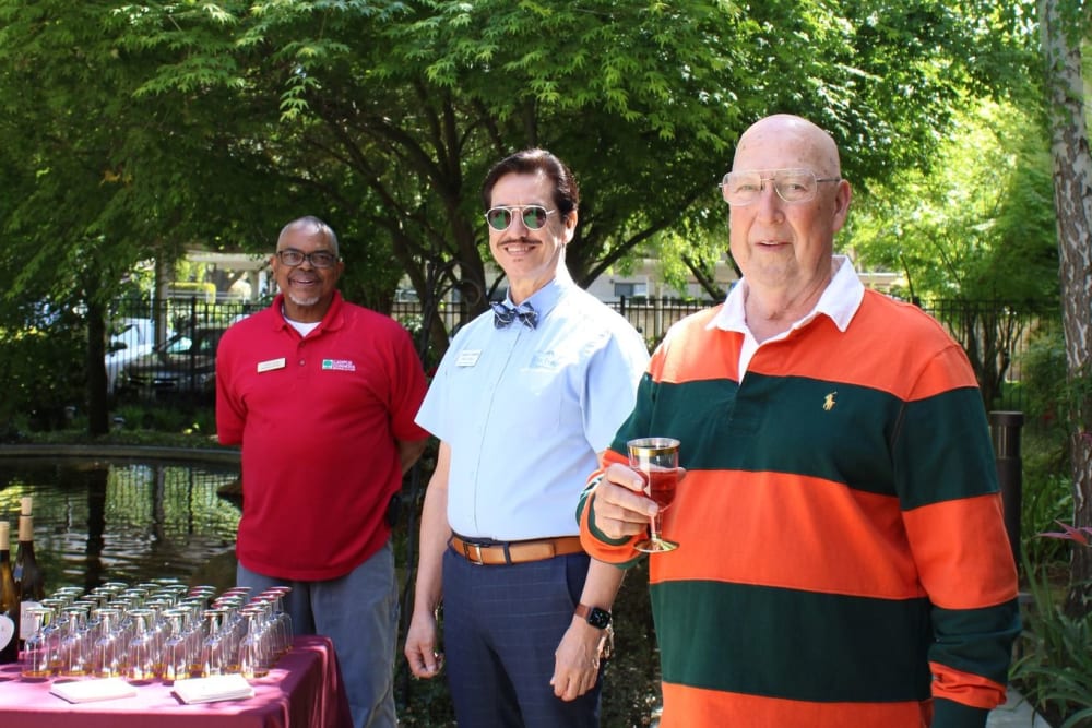 Resident and team members enjoying an event at Campus Commons Senior Living in Sacramento, California