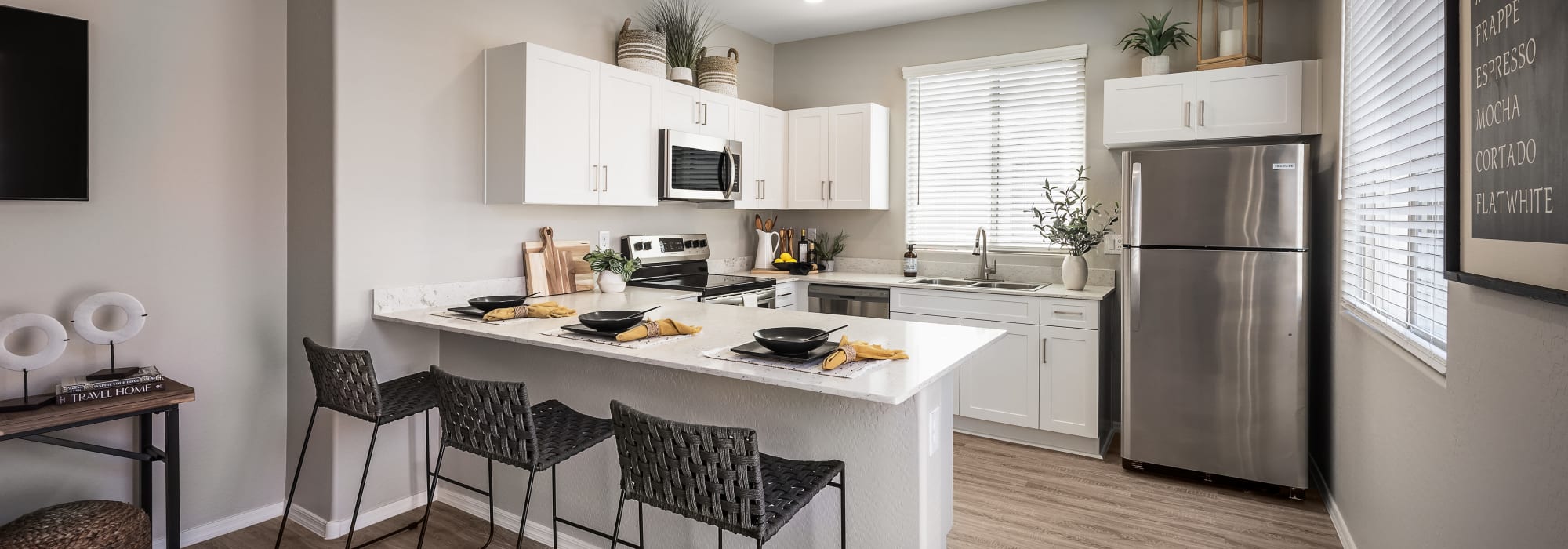 Upgraded kitchen with stainless-steel appliances at TerraLane on Cotton in Surprise, Arizona