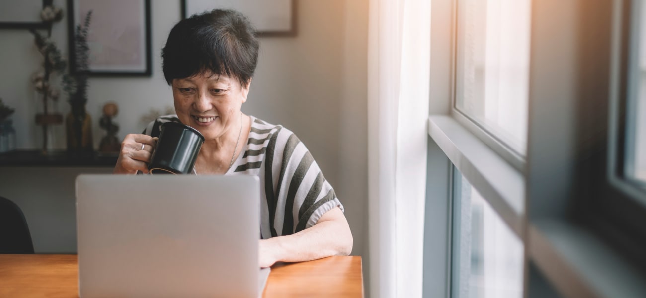 A resident watching a Merrill Gardens webinar. 