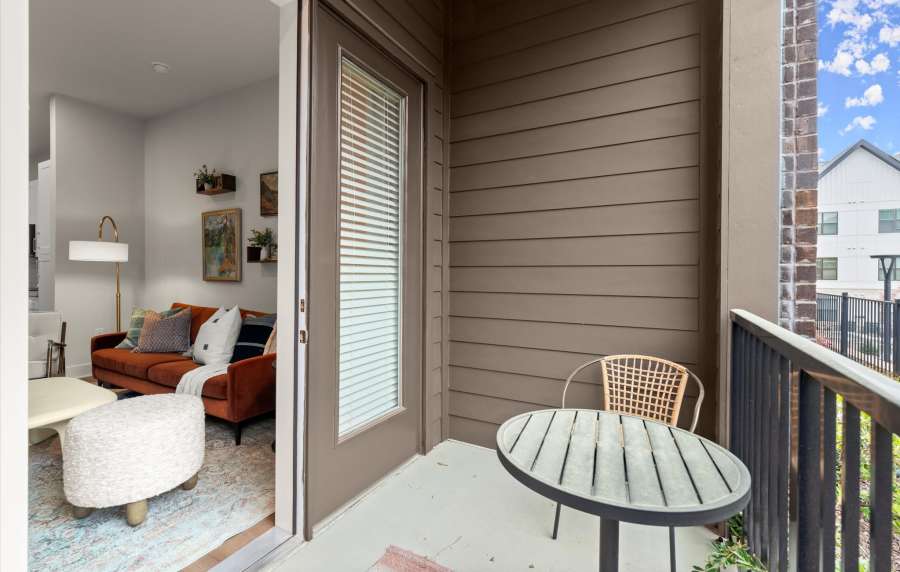 Living room and balcony at EVOQ East Cobb in Marietta, Georgia