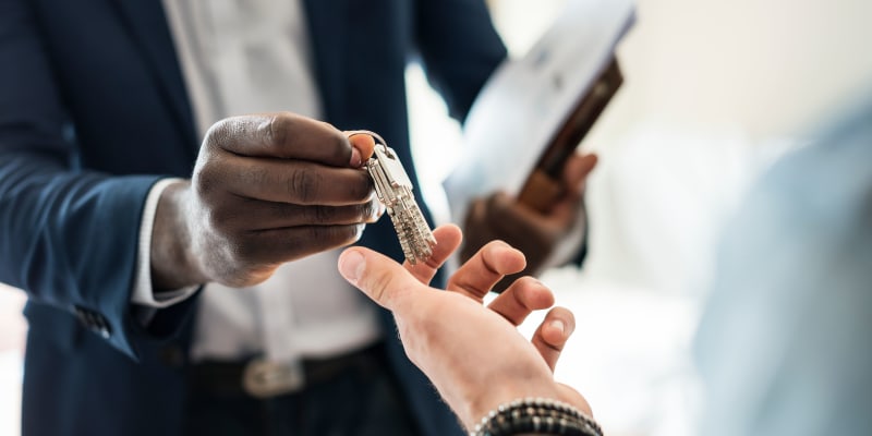 A resident being handed keys at Liberty Military Housing in Newport Beach, California