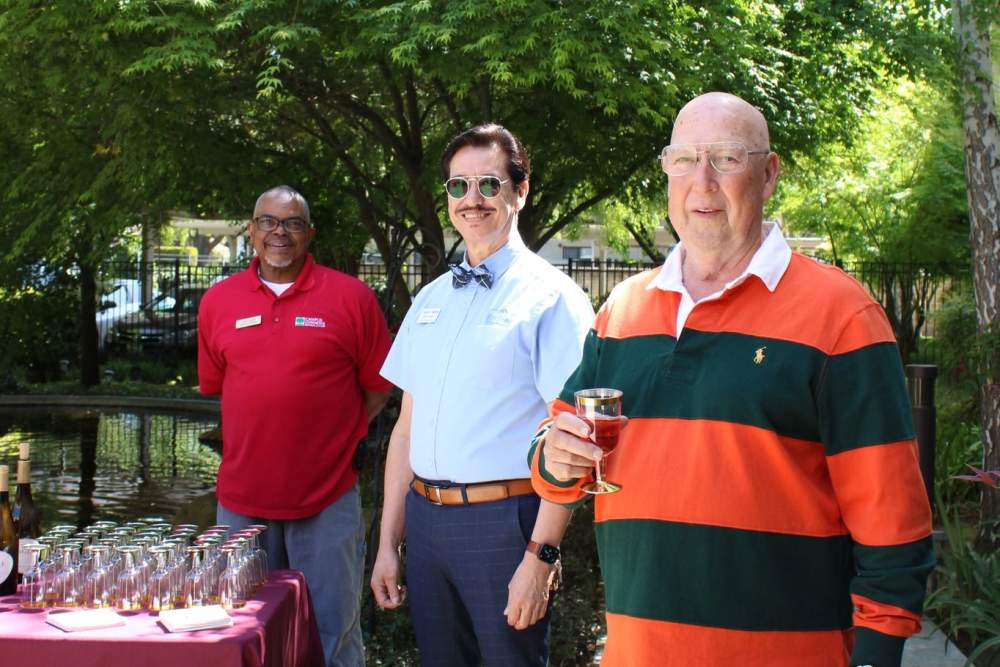 Resident and team members outdoors at Ray Stone Inc. in Sacramento, California