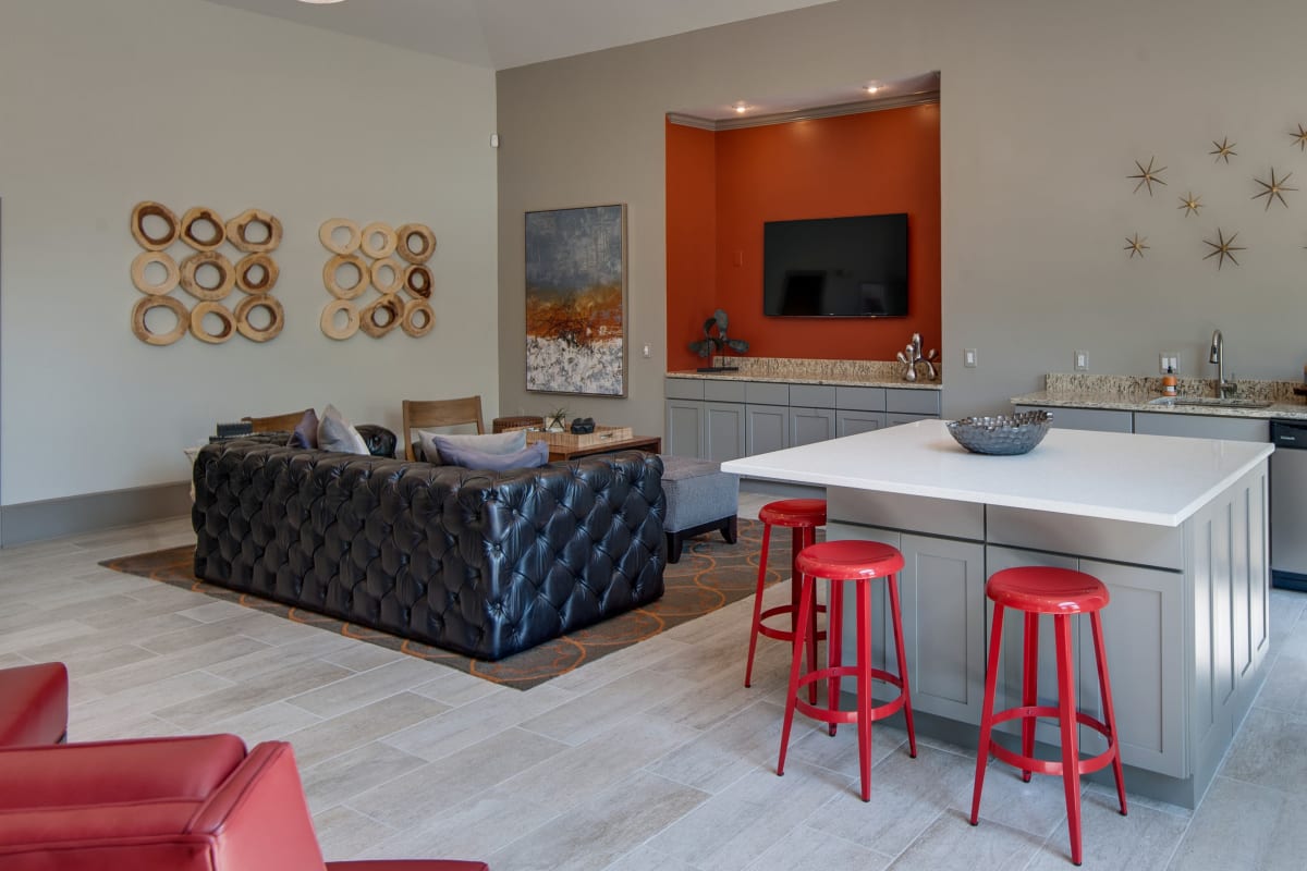 Dining area with red stool seating at Legacy at Meridian in Durham, North Carolina