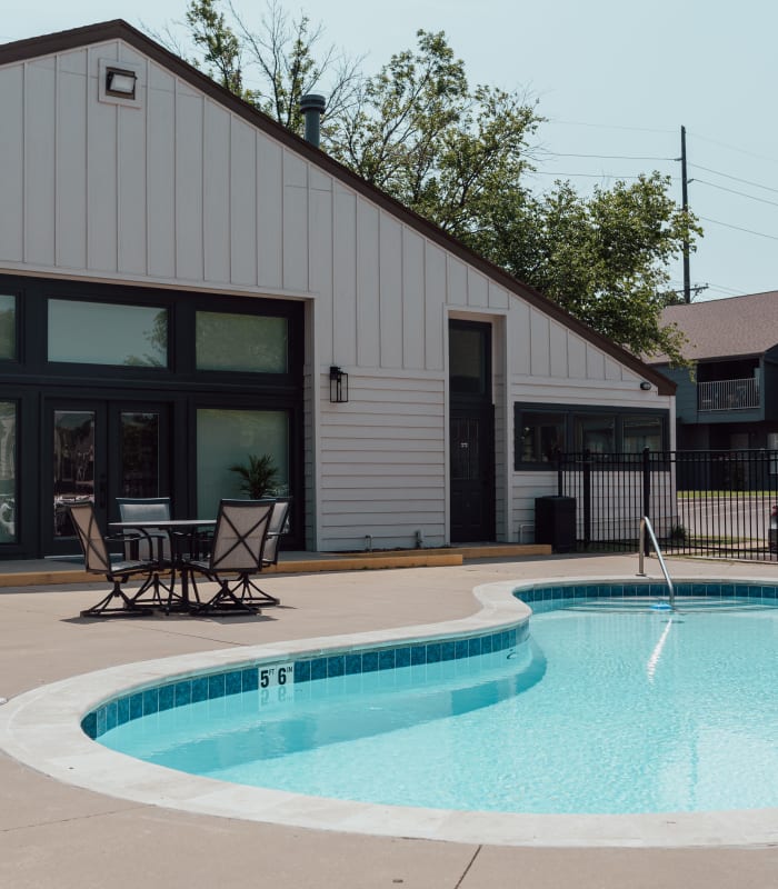 Outdoor swimming pool at Apple Creek Apartments in Stillwater, Oklahoma