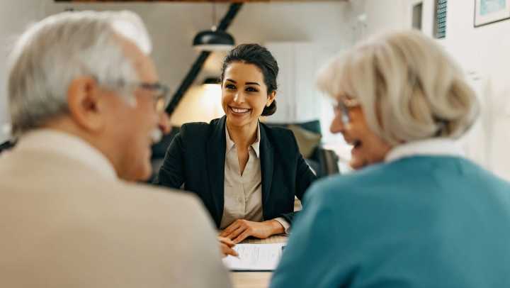 Old man and woman consulting with a consultant