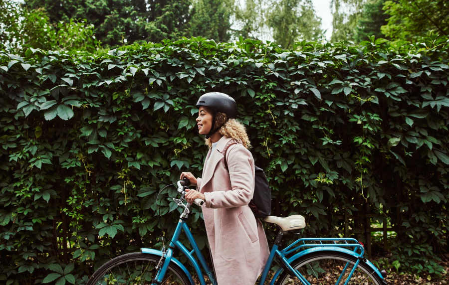 Woman along with her bike at Cotton Wood Apartments in Dublin, California,