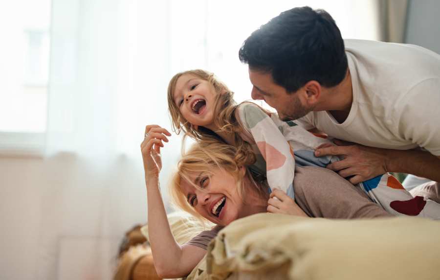 Happy resident family at Heritage Park Apartments & Townhomes in Webster, New York