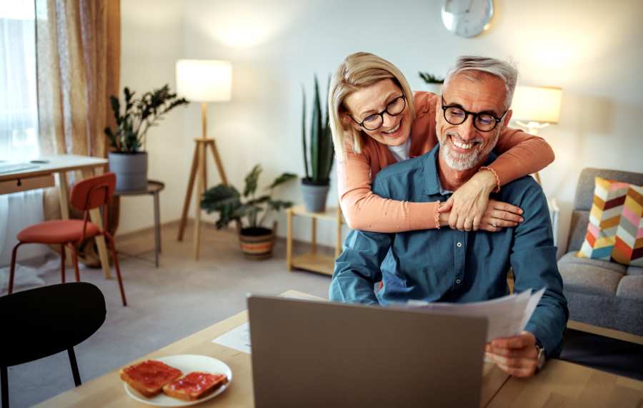 Resident family working on their laptop at Orleans at Fannin Station in Houston, Texas