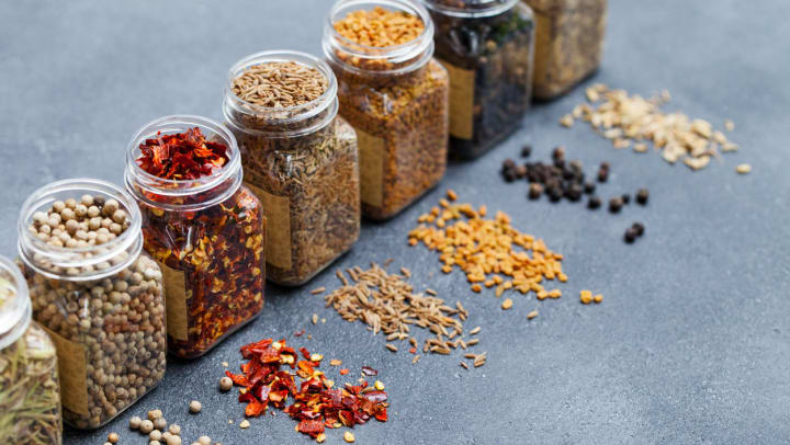 Bottles of spice blends lined up on a counter