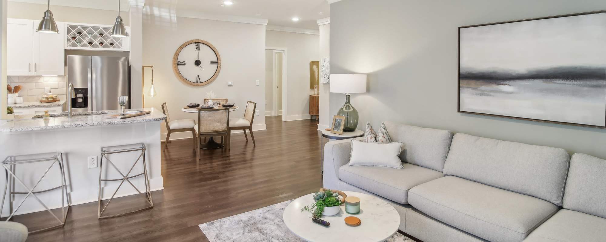 Spacious living room and kitchen of a model apartment at Somerset in McDonough, Georgia