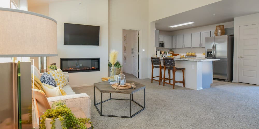 Open living room with LED fireplace at 97@ North Oak in Kansas City, Missouri
