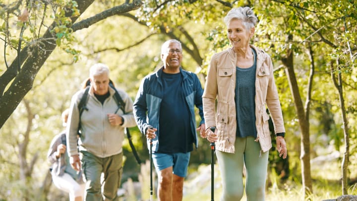 Old man and woman hiking at {{location_name}} in {{location_city}}, {{location_state_name}}