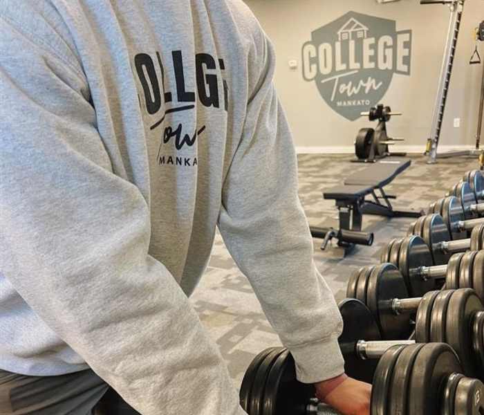 Residents in fitness center at College Town Mankato in Mankato, Minnesota