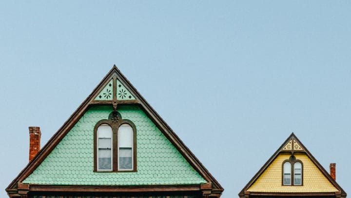Two triangular rooftops of differing size