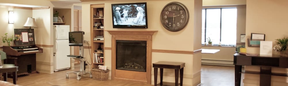 Lounge area with cozy fireplace at East Troy Manor in East Troy, Wisconsin