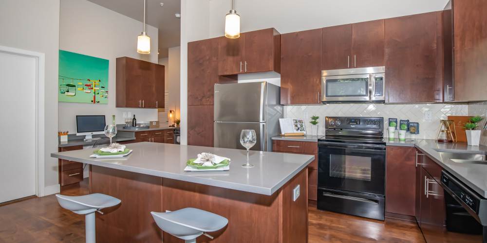 Kitchen with stainless-steel appliances at Park Place Olde Town Apartments in Arvada,Colorado
