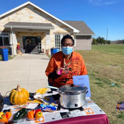 Masked Caregiver at Oxford Glen Memory Care at Sachse in Sachse, Texas