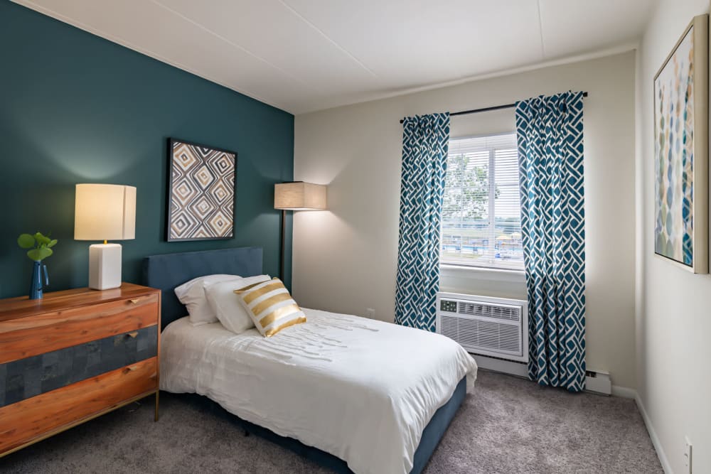 Beautifully decorated bedroom at William Penn Village Apartment Homes in New Castle, Delaware
