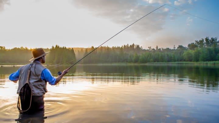 Resident fishing at a lake near Olympus Steelyard in Chandler, Arizona. 