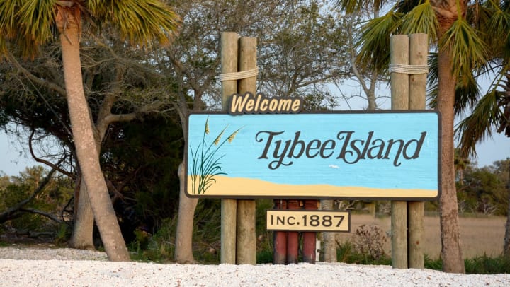 A sign of Tybee Island near the beach.