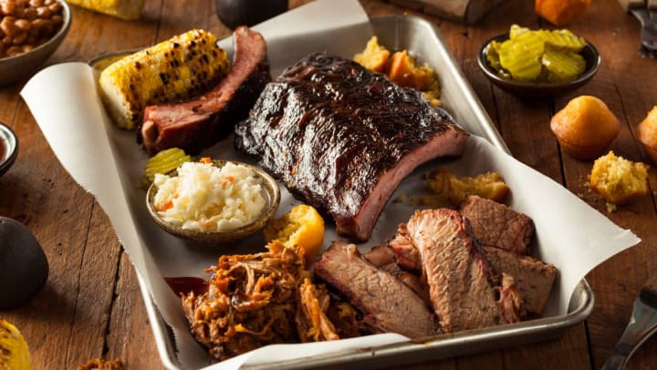 BBQ platter with ribs, smoked brisket, pulled pork, corn, and coleslaw | barbeque restaurants in Irvine