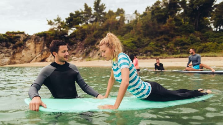 adult learning how to surf