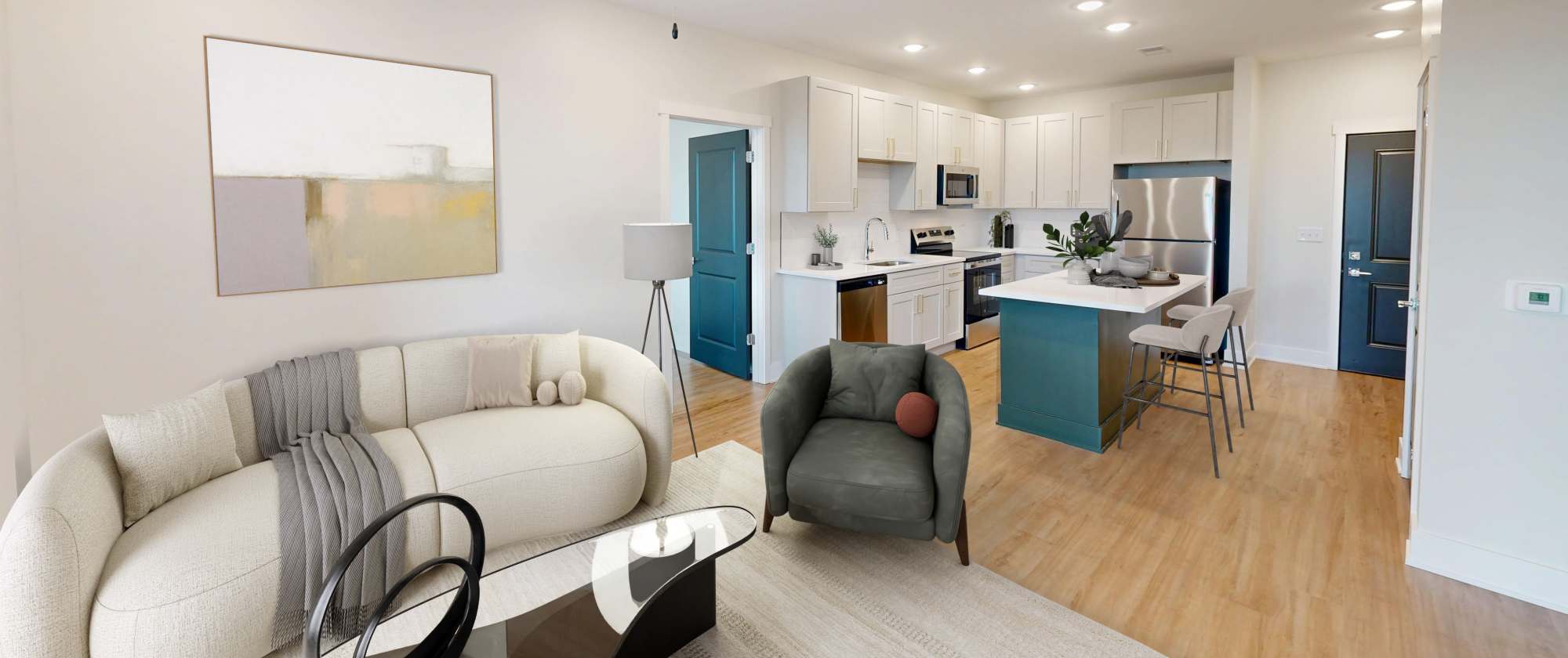 Comfortable sofa in the living room with a view of the kitchen at Factory 52 Apartments in Norwood, Ohio