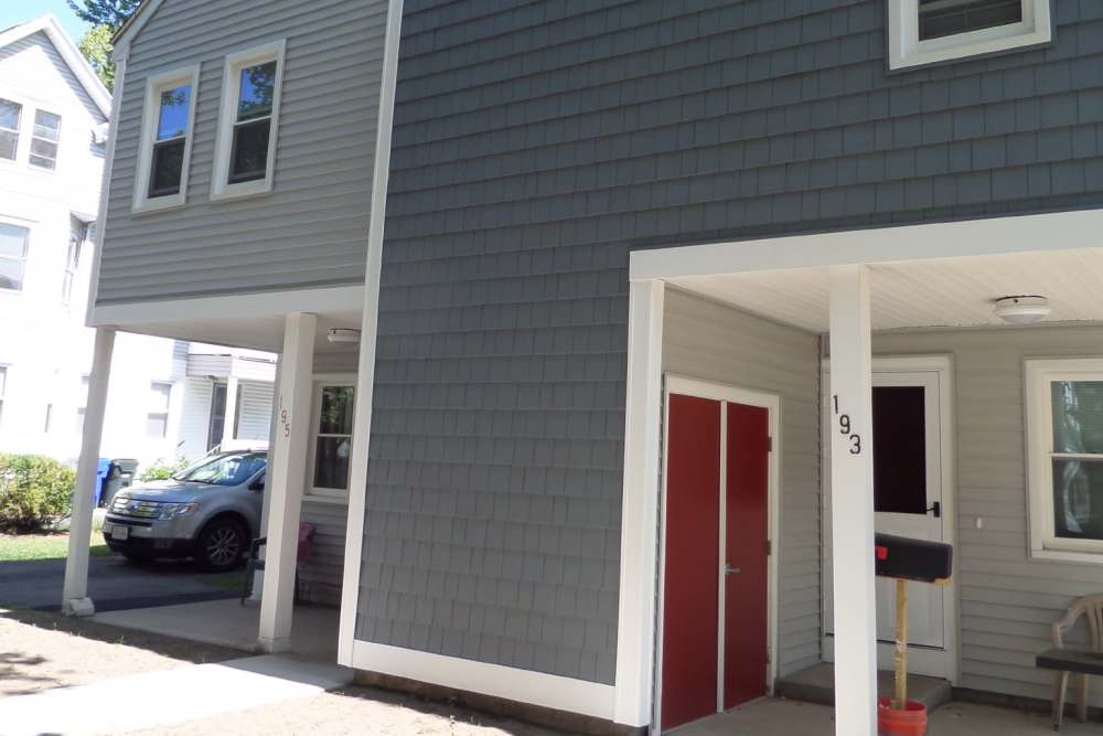 Gabled roof and gray siding at entrance E. Henry Twiggs Estates Phase I in Springfield, Massachusetts