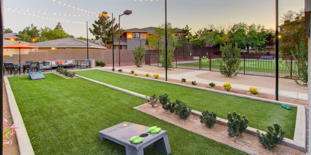 Outdoor area with cornhole and bocce ball at Falling Water Apartments in Las Vegas, Nevada