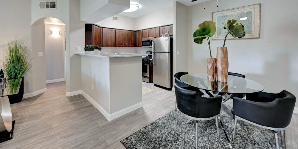 Model kitchen and dining area at Canyon Villas Apartments in Las Vegas, Nevada