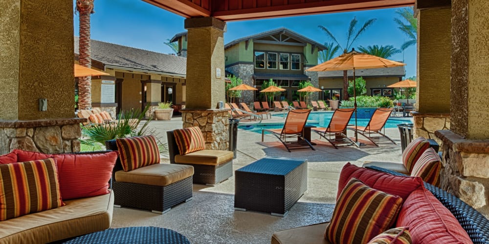 Covered poolside seating at One North Scottsdale Apartments in Scottsdale, Arizona