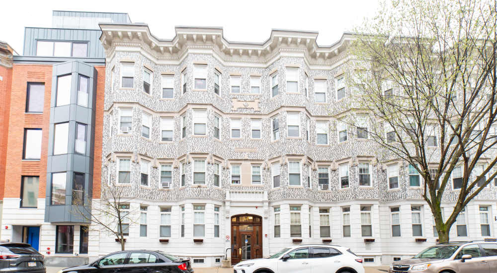 Decorative building facade with multiple windows at 15-25 Hemenway Apartments in Boston, Massachusetts