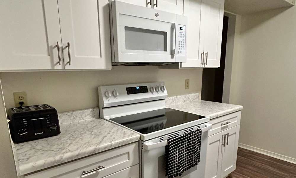 Renovated kitchen complete with brand new appliances, cabinets, and countertops at an apartment at River Club in Evansville, Indiana