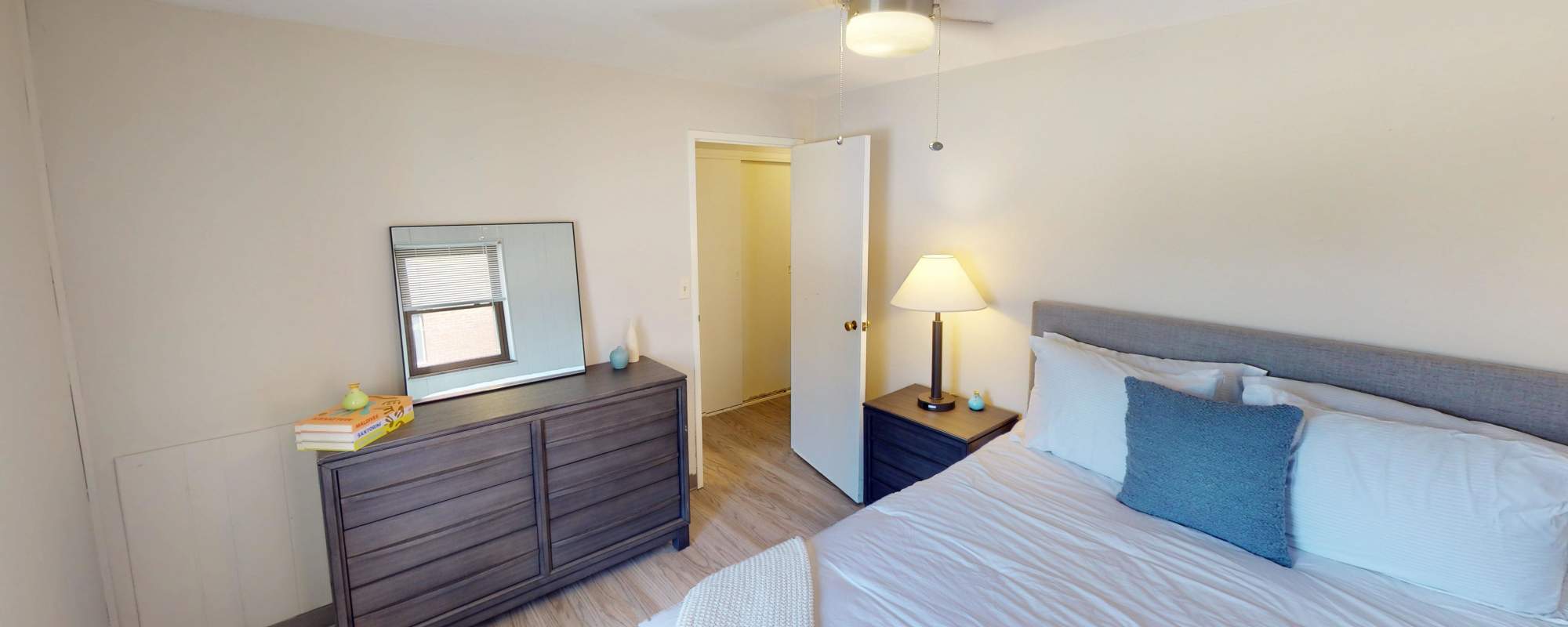 Bedroom with a mirror at Lebanon Vue in Pittsburgh, Pennsylvania