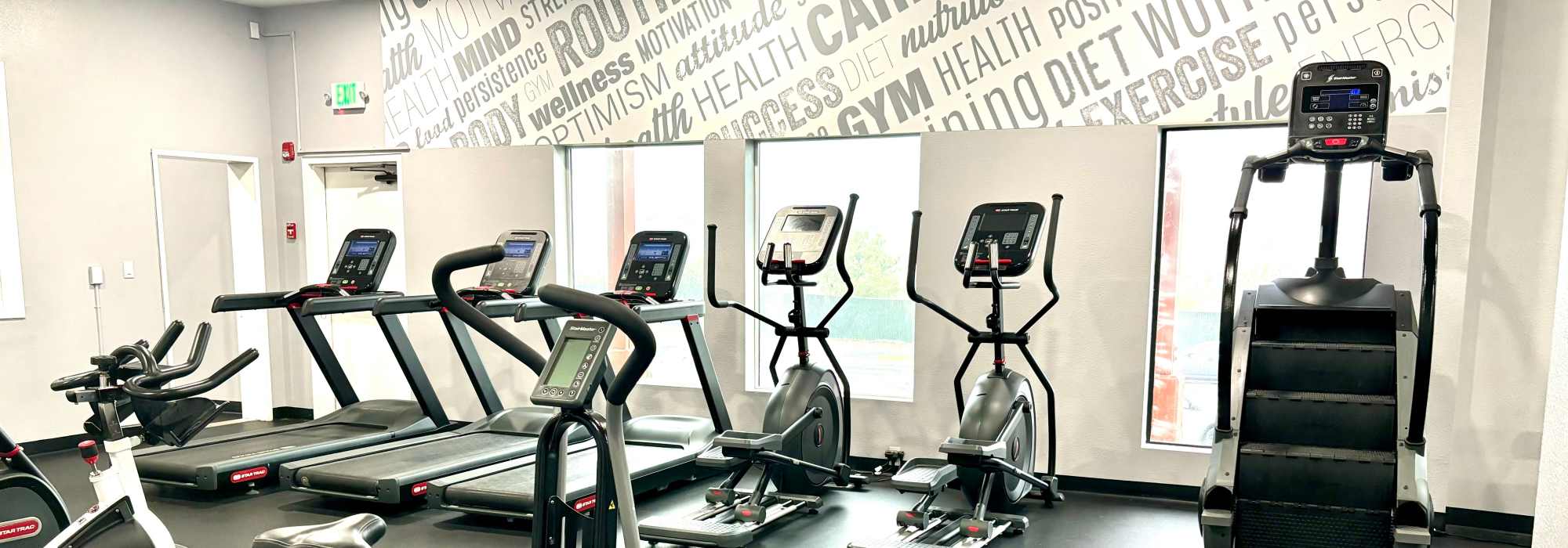 Cardio and weight lifting equipment in the fitness center at Lakewood Apartments at Lake Merced in San Francisco, California