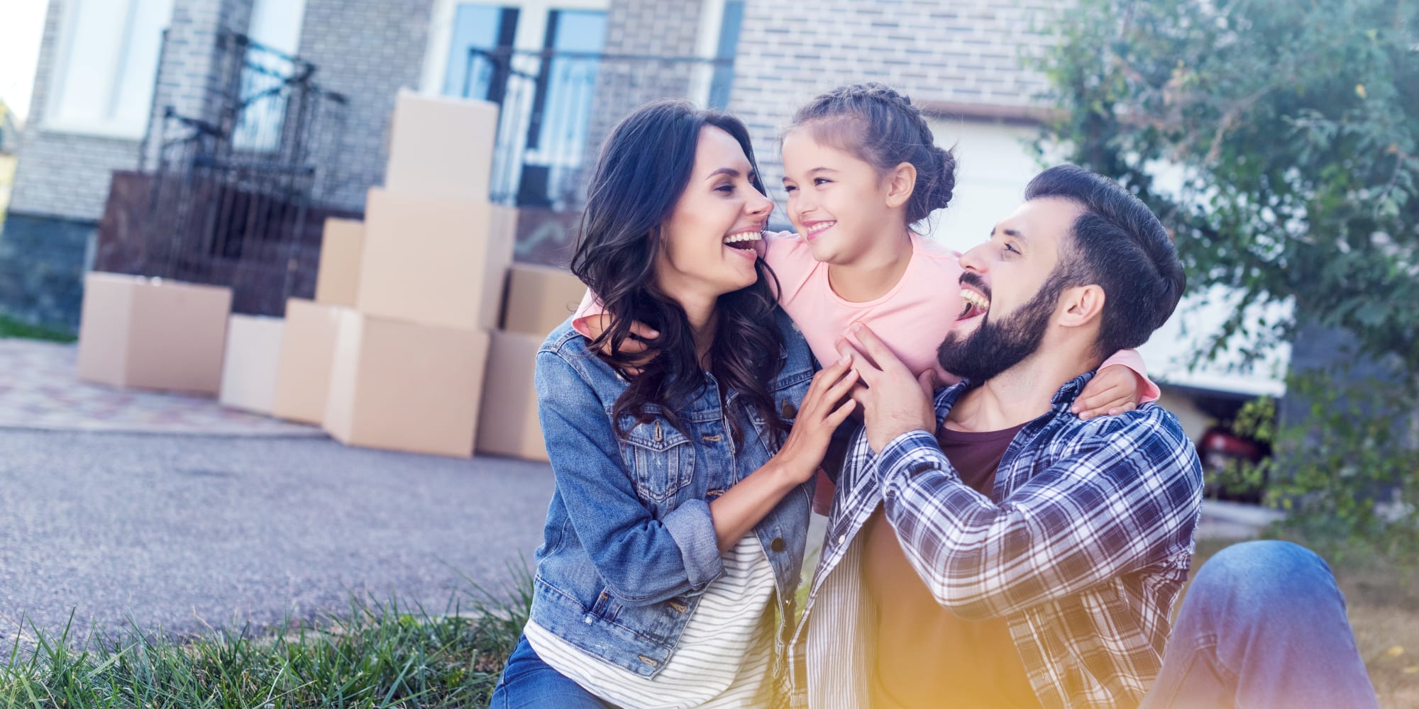 Family and moving boxes near Castro Valley Hayward Storage LLC in Castro Valley, California