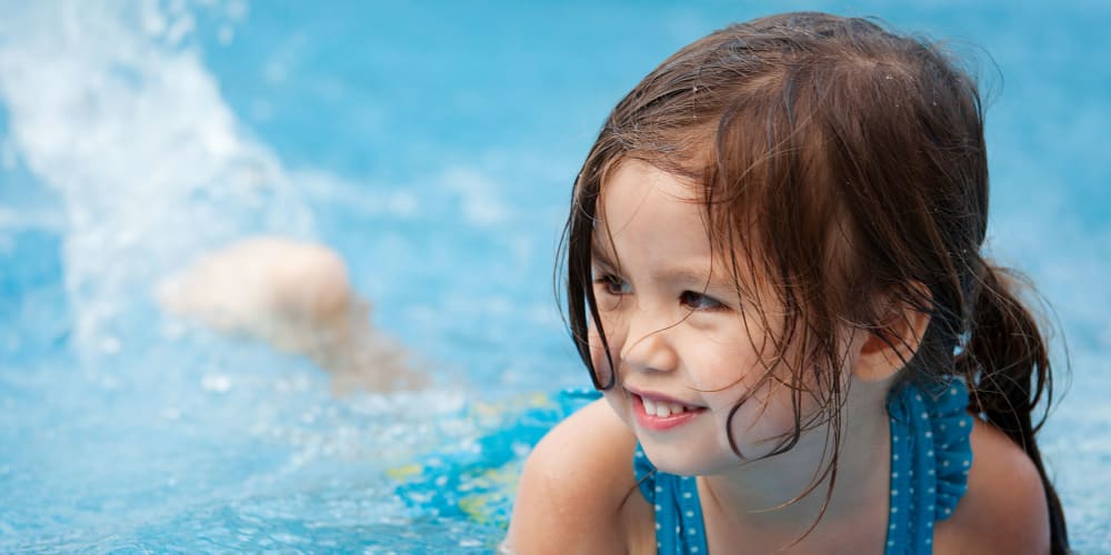Girl having fun in the pool at Garland Square in Norman, Oklahoma
